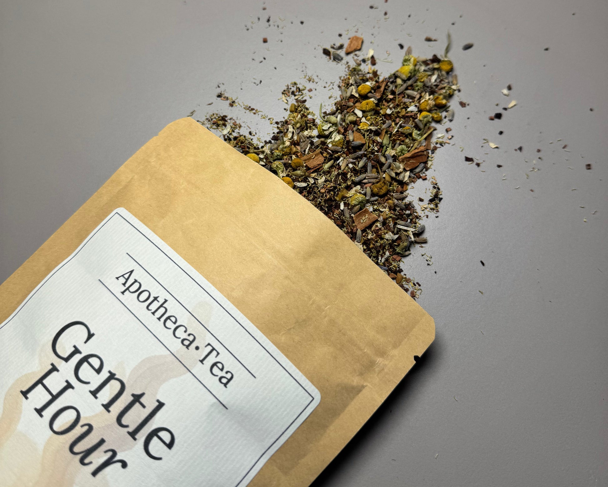 Gentle hour tea blend brown packet with tea blend spilling out.