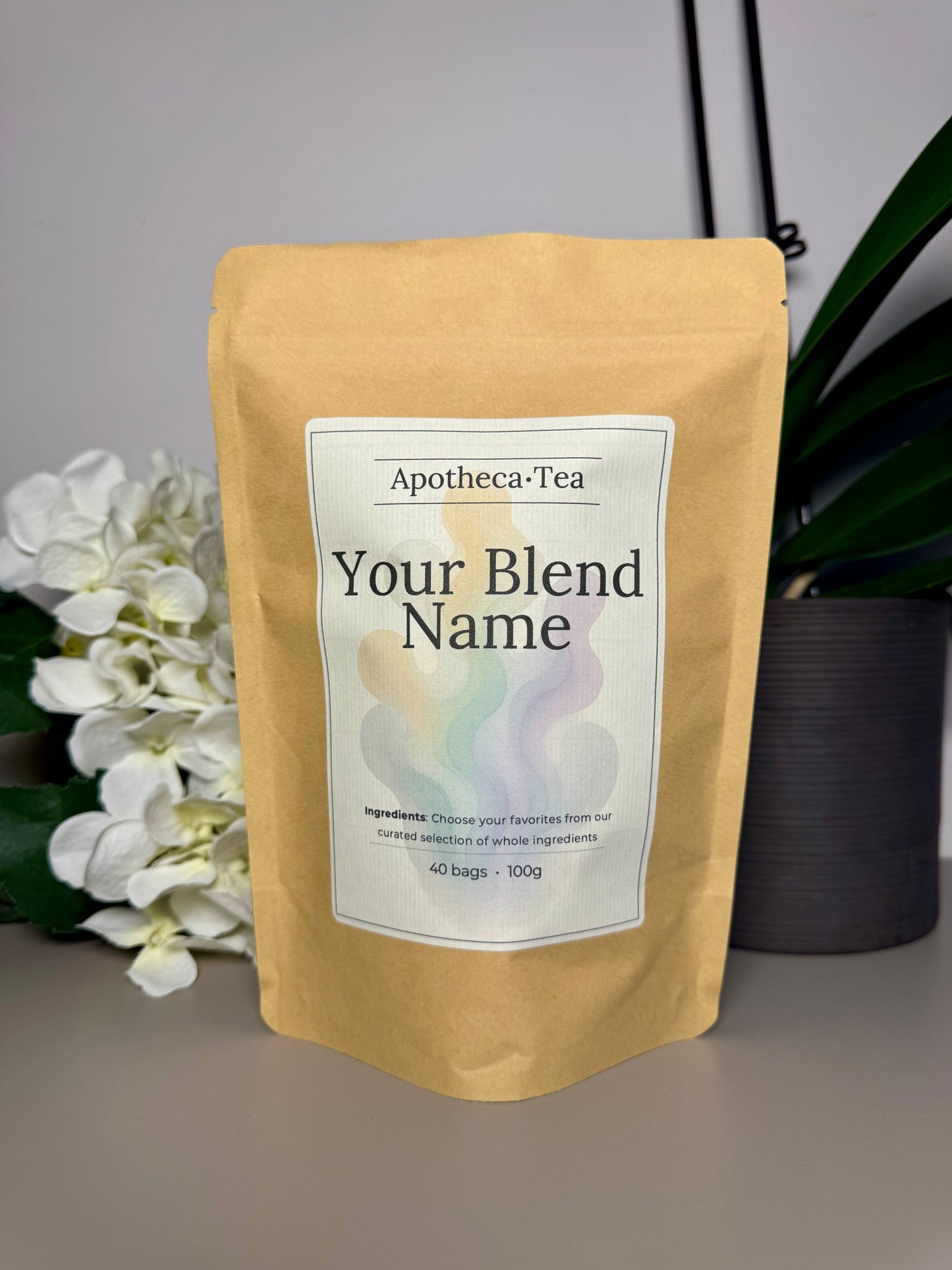 Tea package with 'Your Blend Name' label on a neutral background
