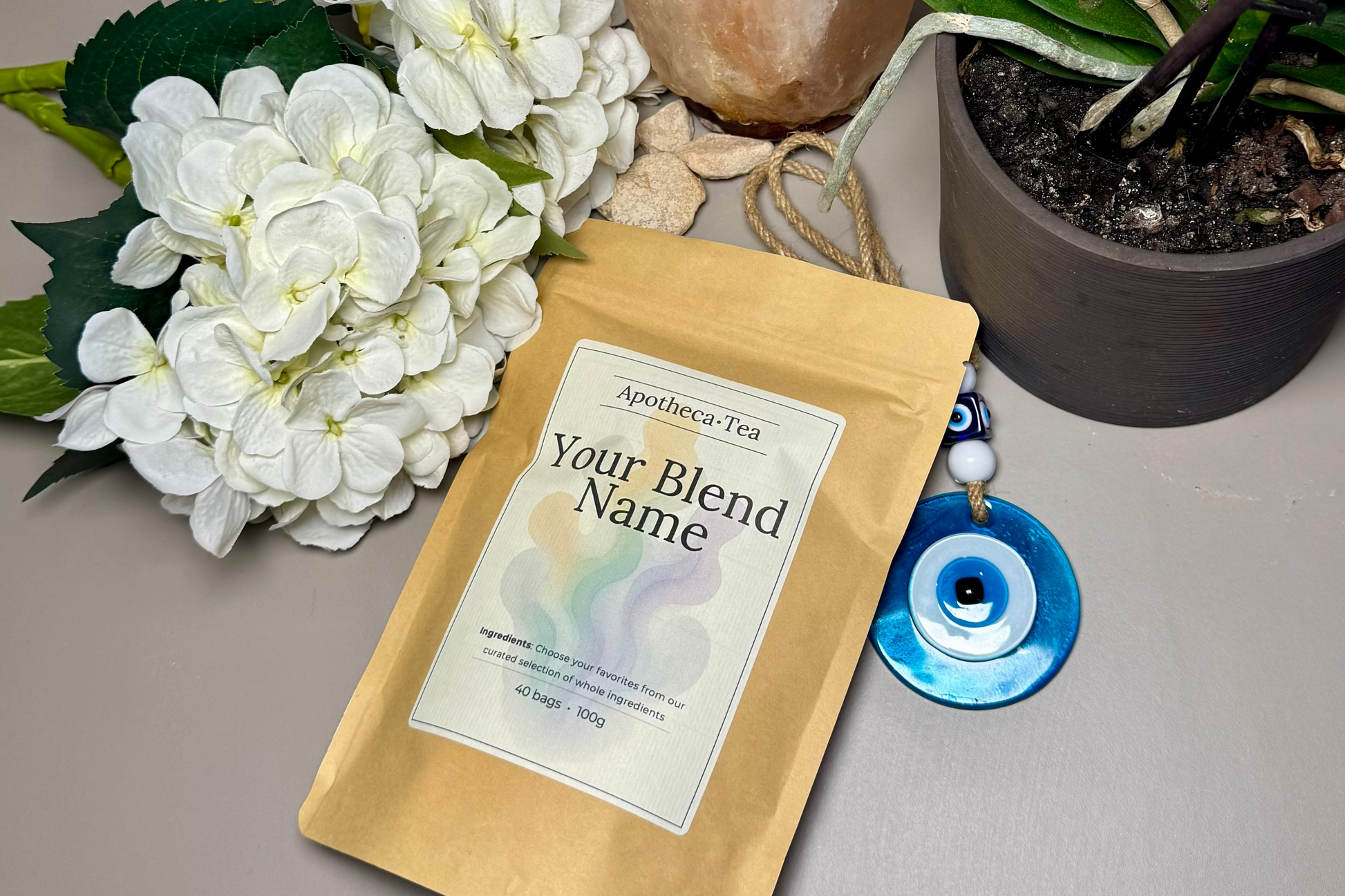 Tea blend package with decorative elements on a neutral surface